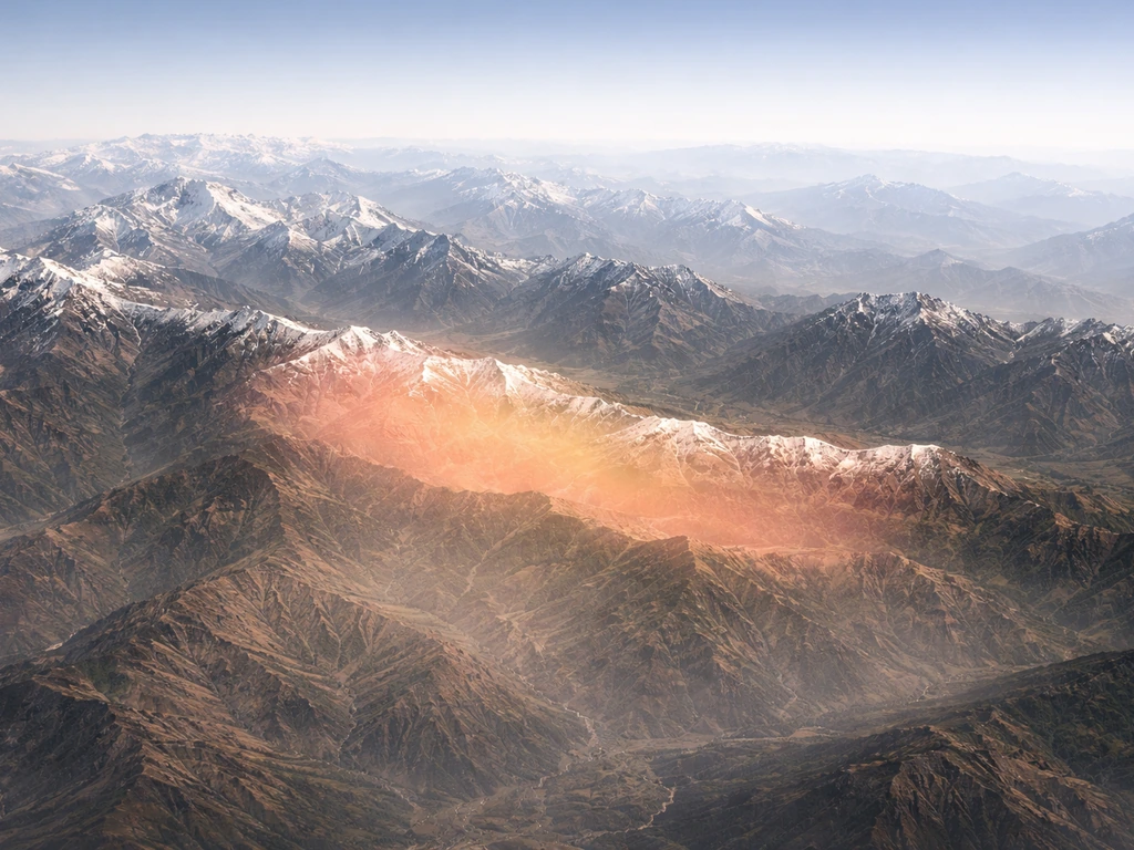 Aerial view of the Himalayas with Nepal subtly highlighted to indicate the monal’s native range.